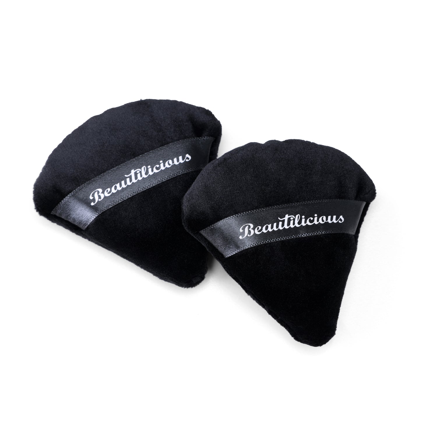 Soft black triangular Pizza Puff makeup applicator from Beautilicious